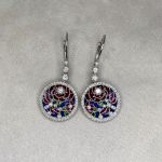 Langley Earrings framed by a halo of diamonds