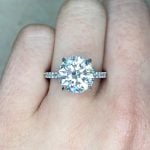 GIA-certified 4.01 carat round brilliant center diamond Front Finger View f2 sh4ct2