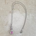 Tiffany Necklace centering a cushion cut natural pink sapphire stone