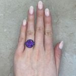 Valsain Ring centers a cushion cut amethyst stone set in a bezel setting.