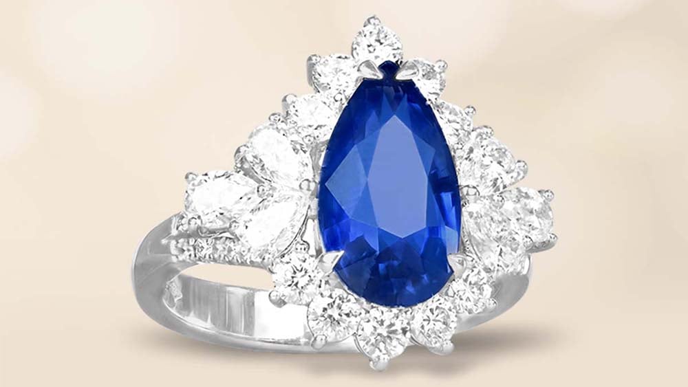 Sapphire ring with a halo of diamonds set in 18k white gold