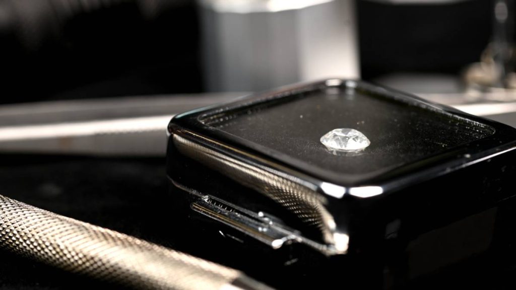 Loose Diamond in Box with Jewelry tools around it