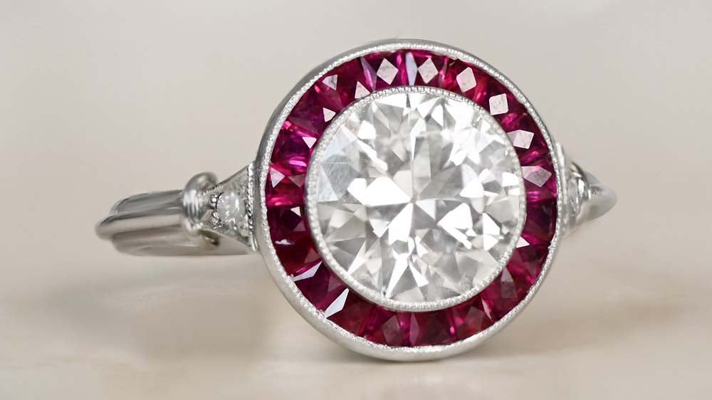 rare antique diamond ring with ruby halo set in platinum