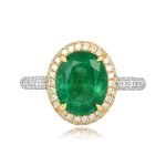 center 3.17 carat oval cut emerald with diamond halo Sandin Ring
