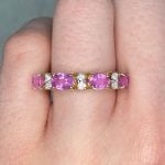 Calles Ring features oval-cut pink sapphire and round diamond stones