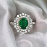 Emerald and Diamond Halo Prisa Ring Hand Photo 5
