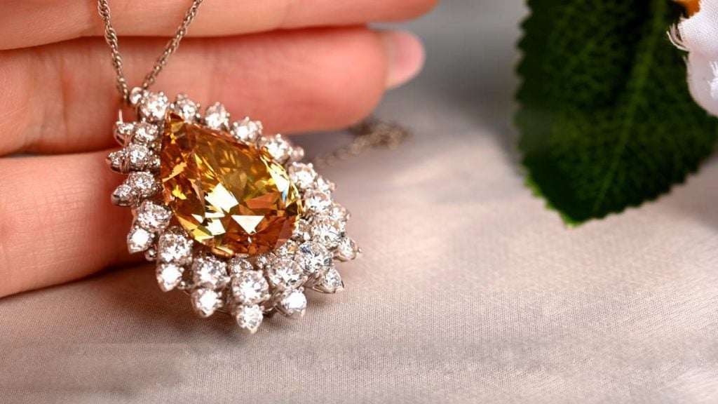 Pear Shape Fancy Yellow Brooch with double halo