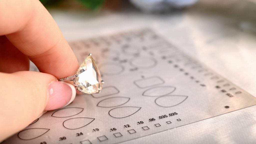 Pear Shaped Rose Cut Diamond Engagement Ring with Measuring