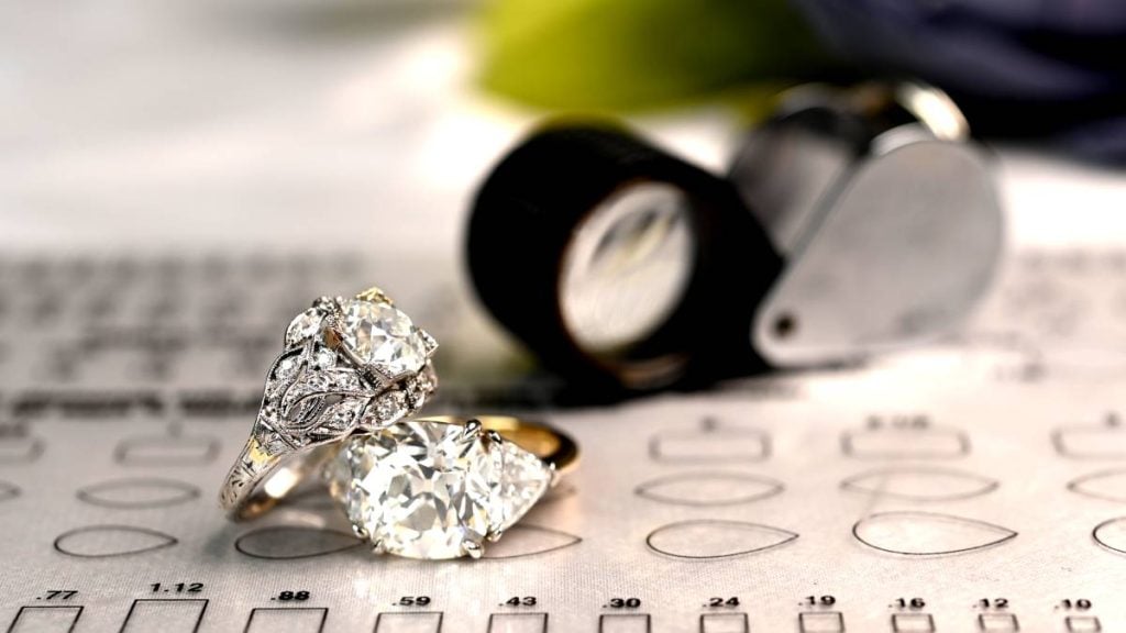 Two VVS Clarity Diamond Rings with Loupe in Showroom