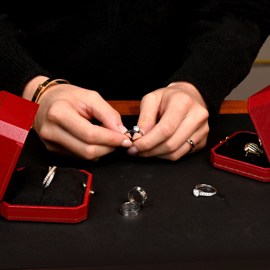 SQ Examining and Selling Cartier Jewelry in EDJ Showroom