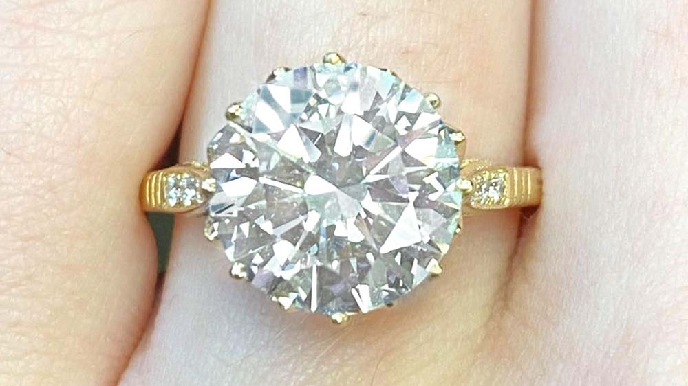 diamond ring in 18k yellow gold crown setting with surrounding diamonds