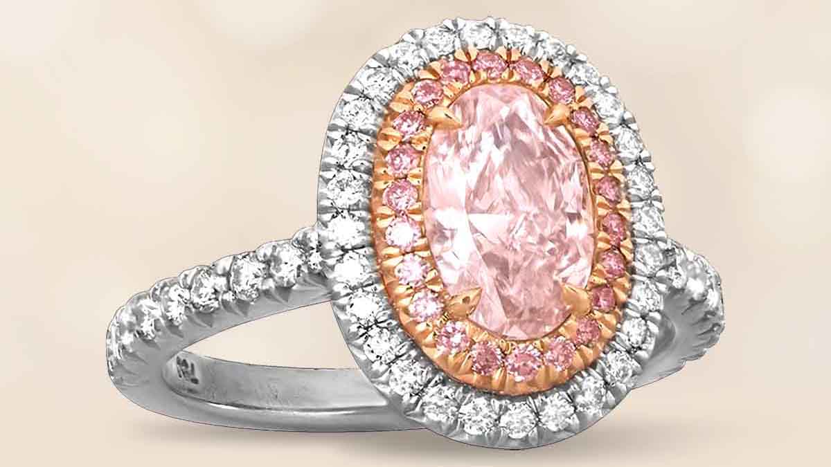 A pink diamond ring with pink and white diamond halos.