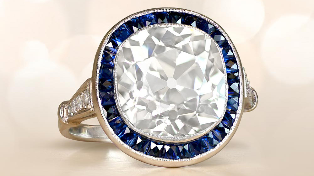 diamond ring in platinum with a halo of sapphires