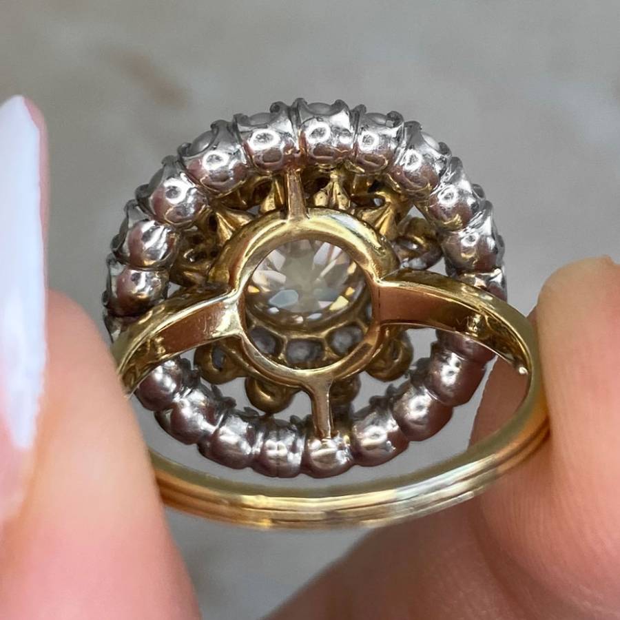 Close-up view of an antique engagement ring being held
