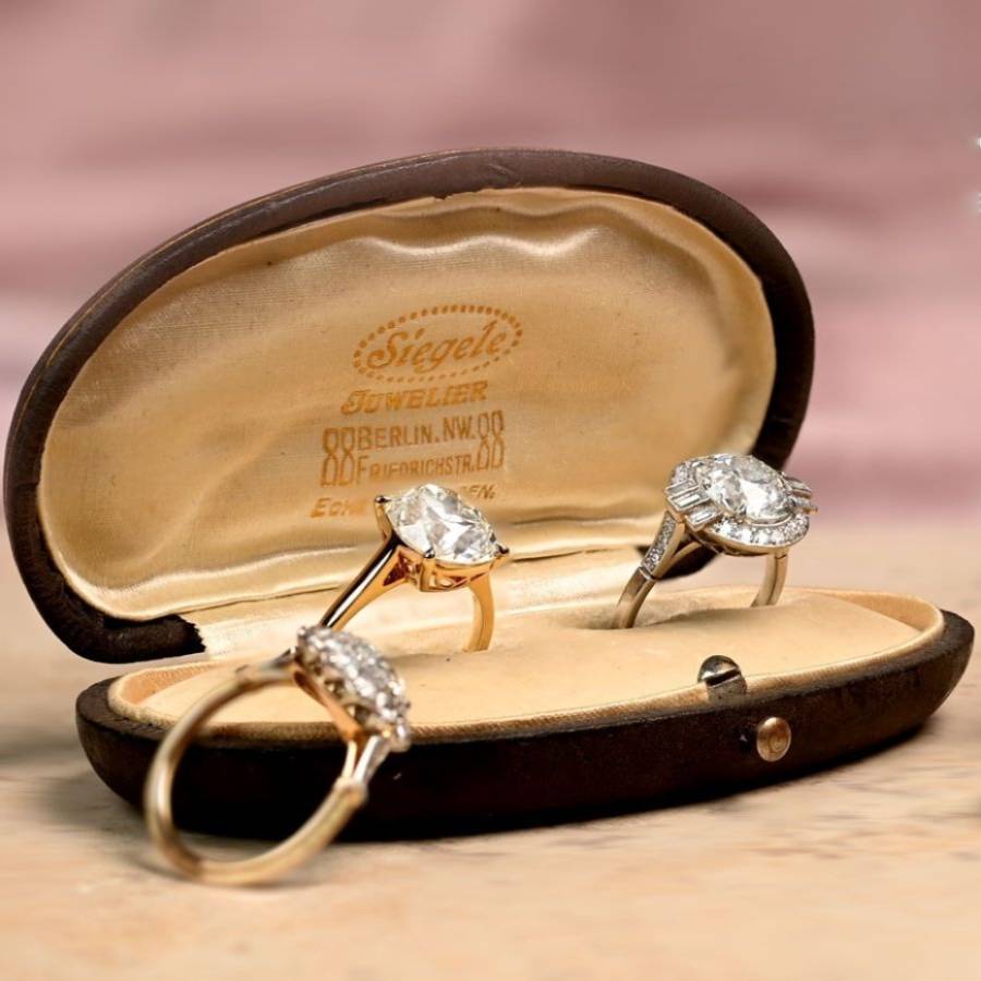 Vintage engagement rings displayed in a jewelry box